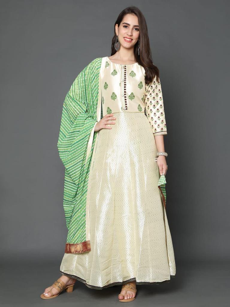 Beige Art silk suit accessorised with lehriya duppata