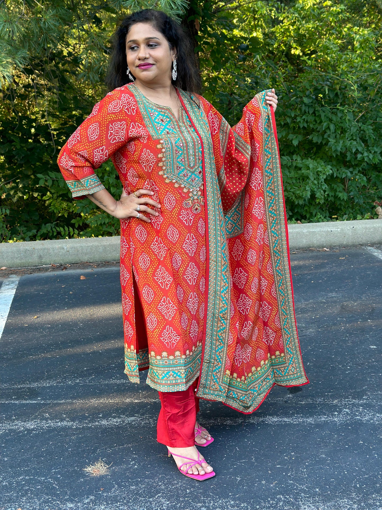 Orange Bandhani print Chinon silk suit highlighted with pearl, Cutdana & thread hand work