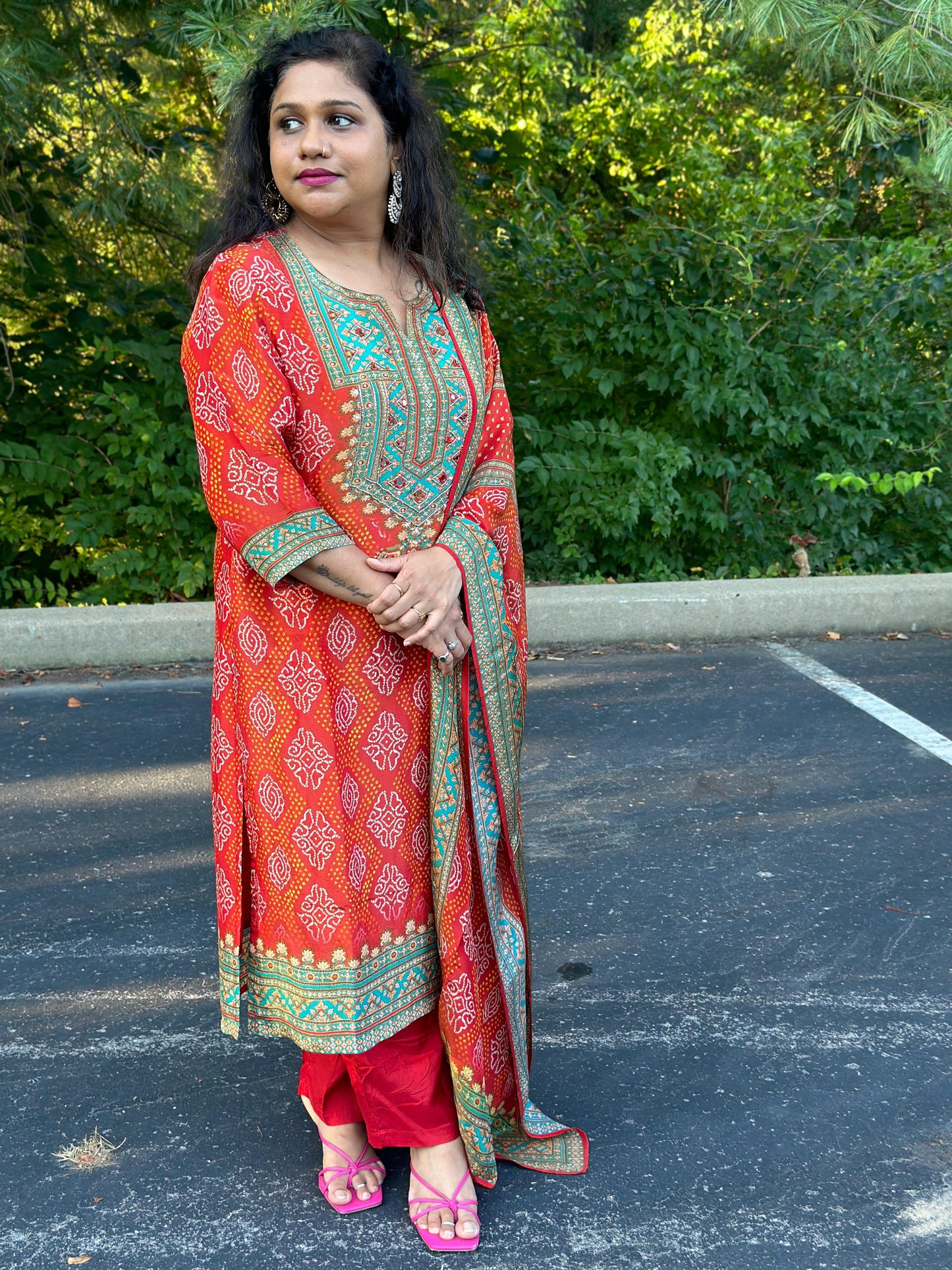 Orange Bandhani print Chinon silk suit highlighted with pearl, Cutdana & thread hand work