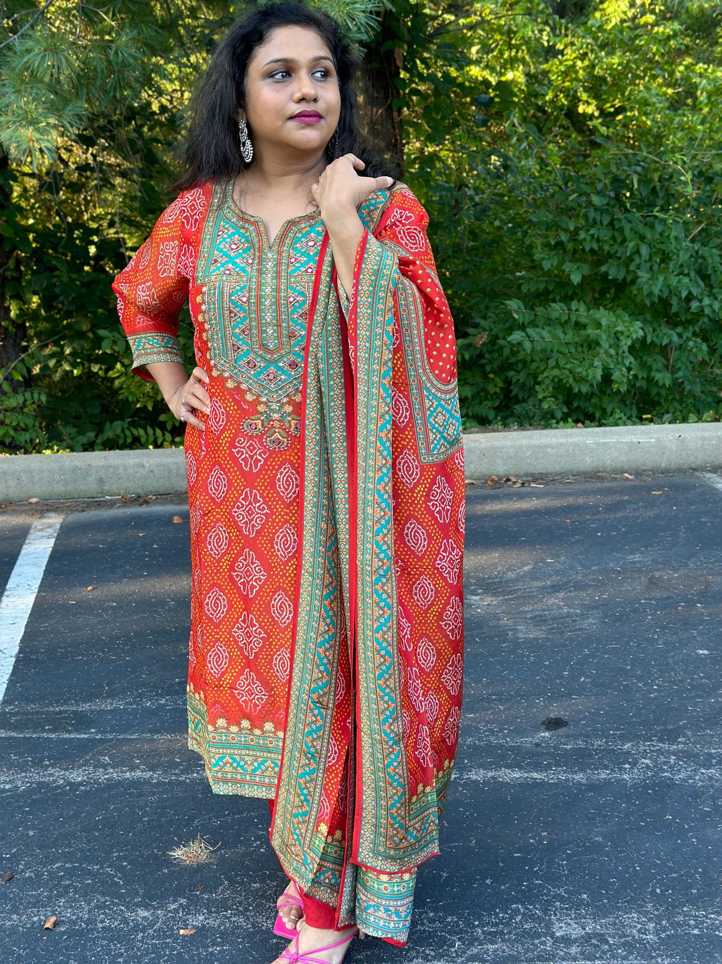 Orange Bandhani print Chinon silk suit highlighted with pearl, Cutdana & thread hand work