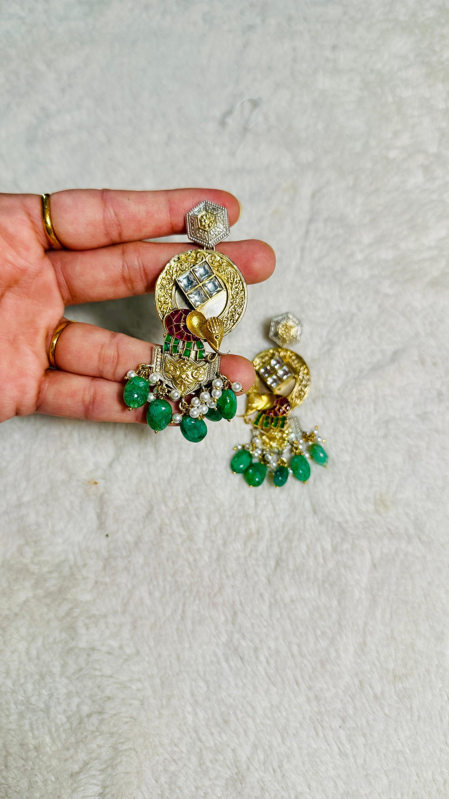 Pure 92.5 Silver Dual tone Elephant Earrings embellished with Emerald green beads along with Fresh water pearls.