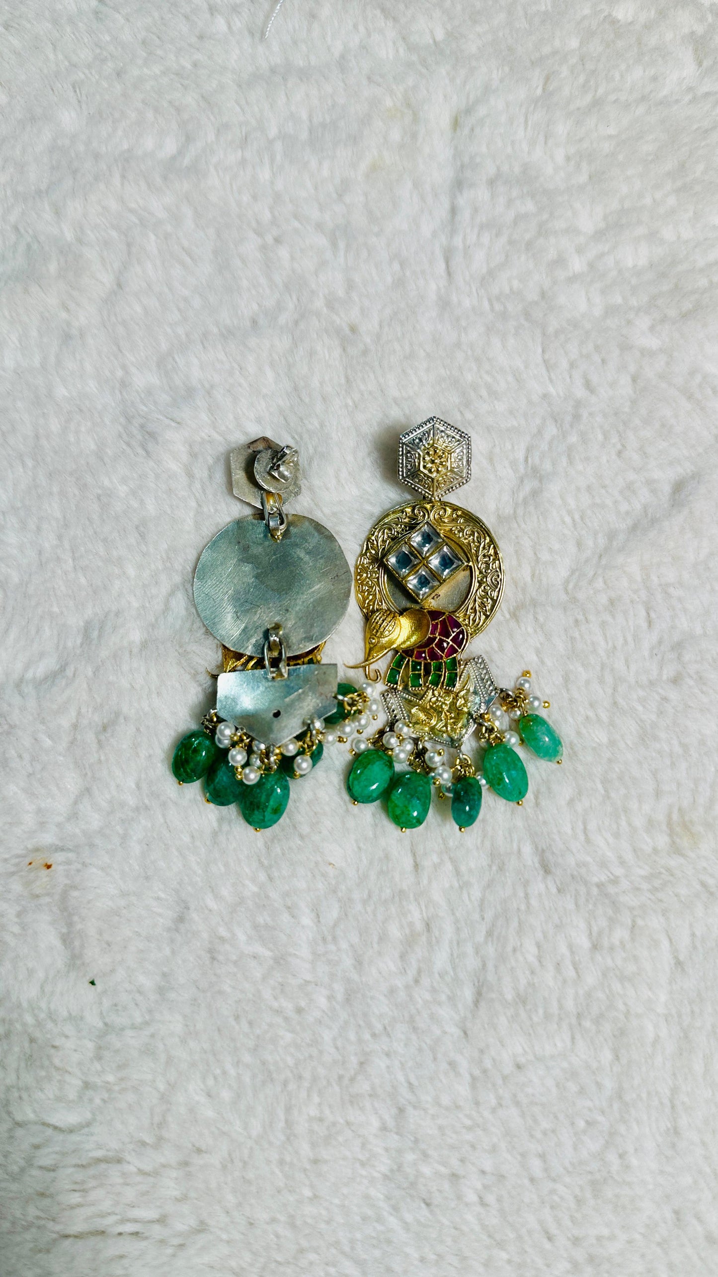 Pure 92.5 Silver Dual tone Elephant Earrings embellished with Emerald green beads along with Fresh water pearls.