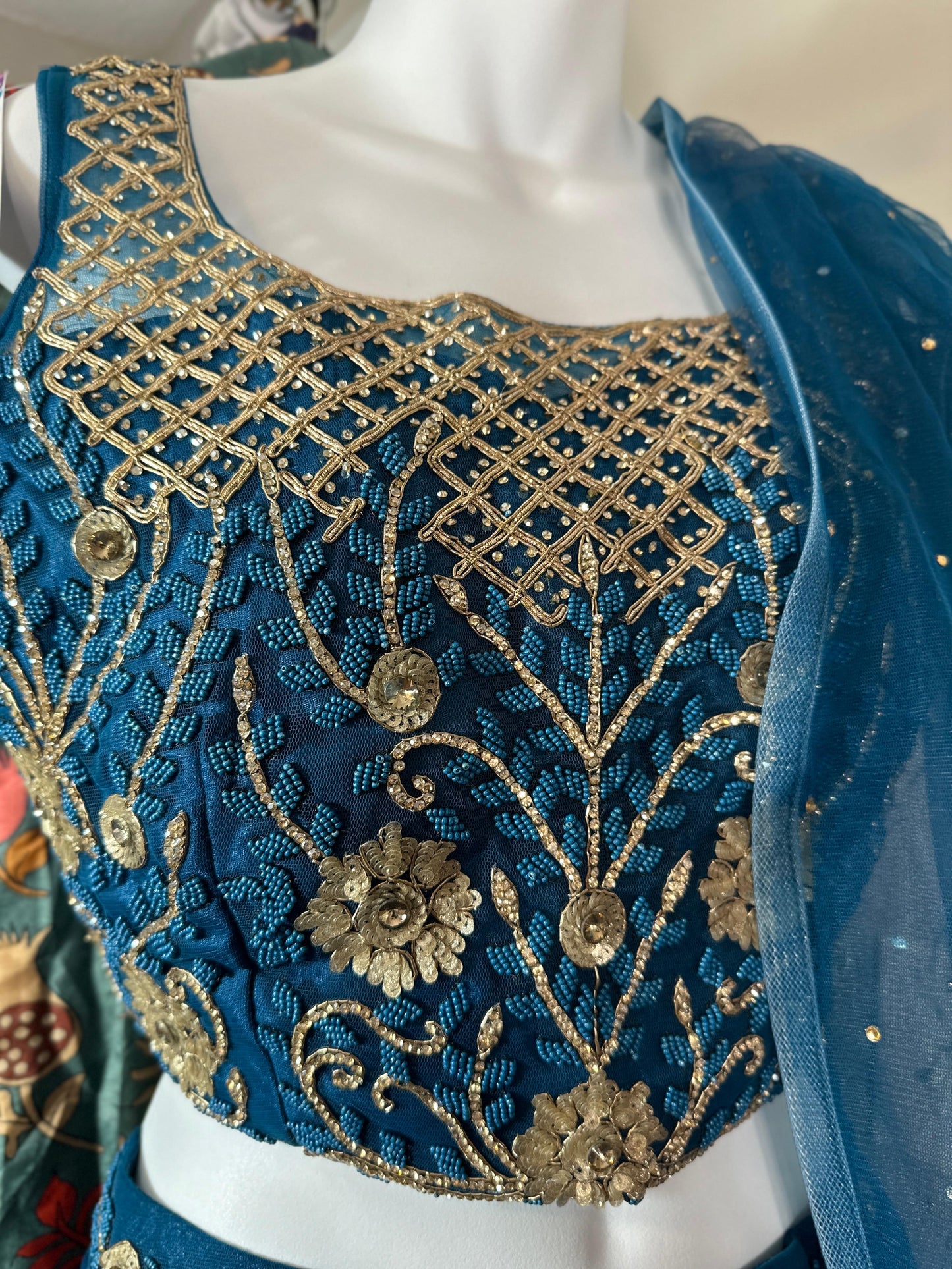 Teal Blue designer Lehenga highlighted with all Pearl & semiprecious stone, Cutdana, sequins handwork