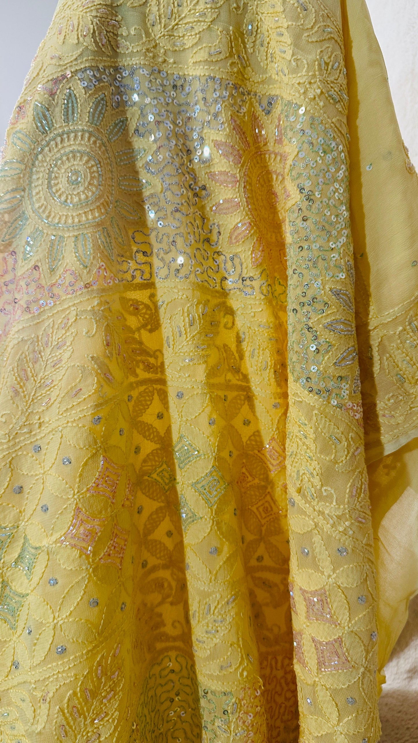 Lime yellow Pure Georgette Chikankari Saree enteric with fine Chikankari,Cutdana & Ring Mukaish hand embroidery