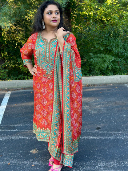 Orange Bandhani print Chinon silk suit highlighted with pearl, Cutdana & thread hand work