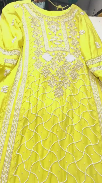 Lime yellow pure Mulmul Pearl suit highlighted with and pearl & Cutdana handwork