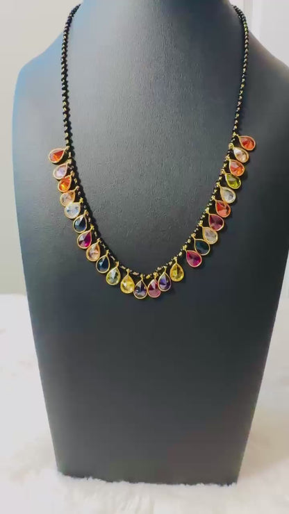 Pure 92.5 Silver Navratan Mangalsutra embellishment with black beads and semiprecious multicoloured gemstone.