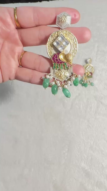 Pure 92.5 Silver Dual tone Elephant Earrings embellished with Emerald green beads along with Fresh water pearls.