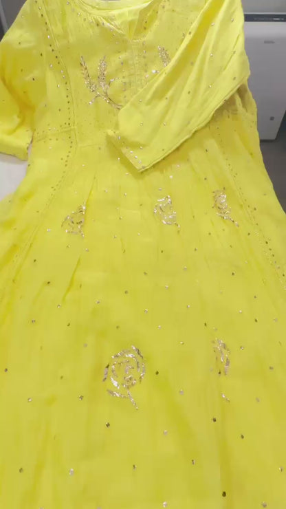 Sunshine Yellow Mulmul Chikankari gown suit highlighted with handwork Mukaish pitta