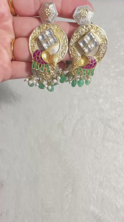 Pure 92.5 Silver Dual tone Elephant Earrings embellished with Emerald green beads along with Fresh water pearls.