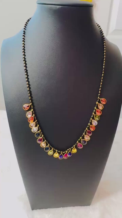 Pure 92.5 Silver Navratan Mangalsutra embellishment with black beads and semiprecious multicoloured gemstone.