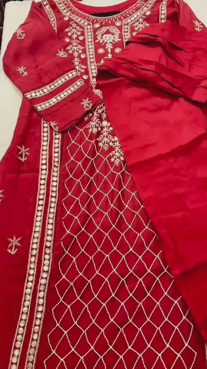 Red  pure Mulmul Pearl suit highlighted with and pearl & Cutdana handwork