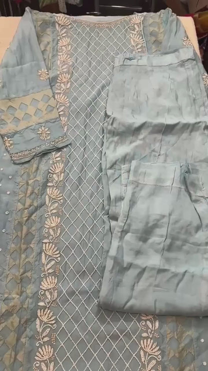 Sky blue pure Mulmul Pearl suit highlighted with and pearl & Cutdana handwork