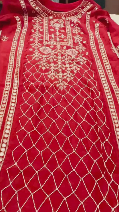 Red  pure Mulmul Pearl suit highlighted with and pearl & Cutdana handwork