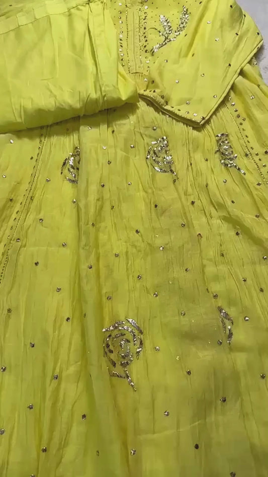 Sunshine Yellow Mulmul Chikankari gown suit highlighted with handwork Mukaish pitta